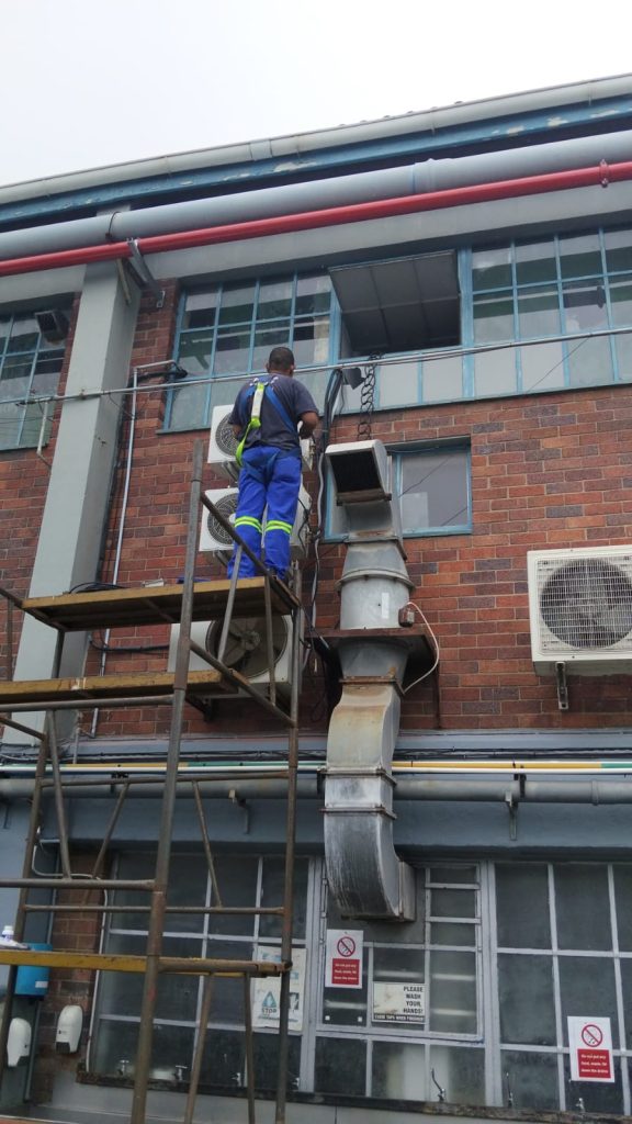 fridge repairs Cape Town technician fixing refrigerator
